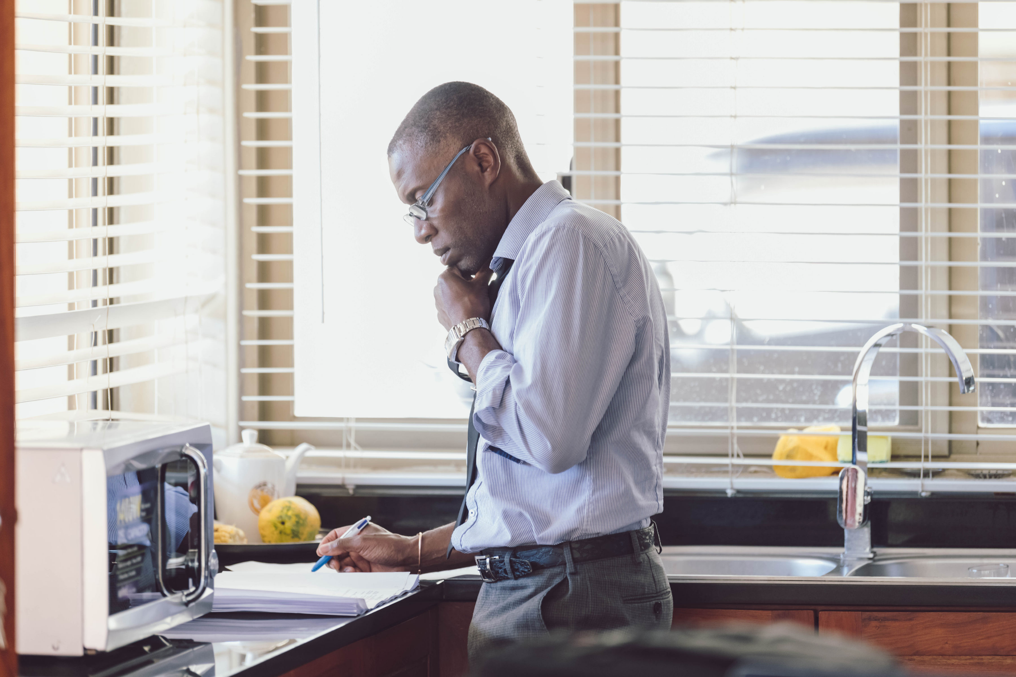 Man taking notes on the phone