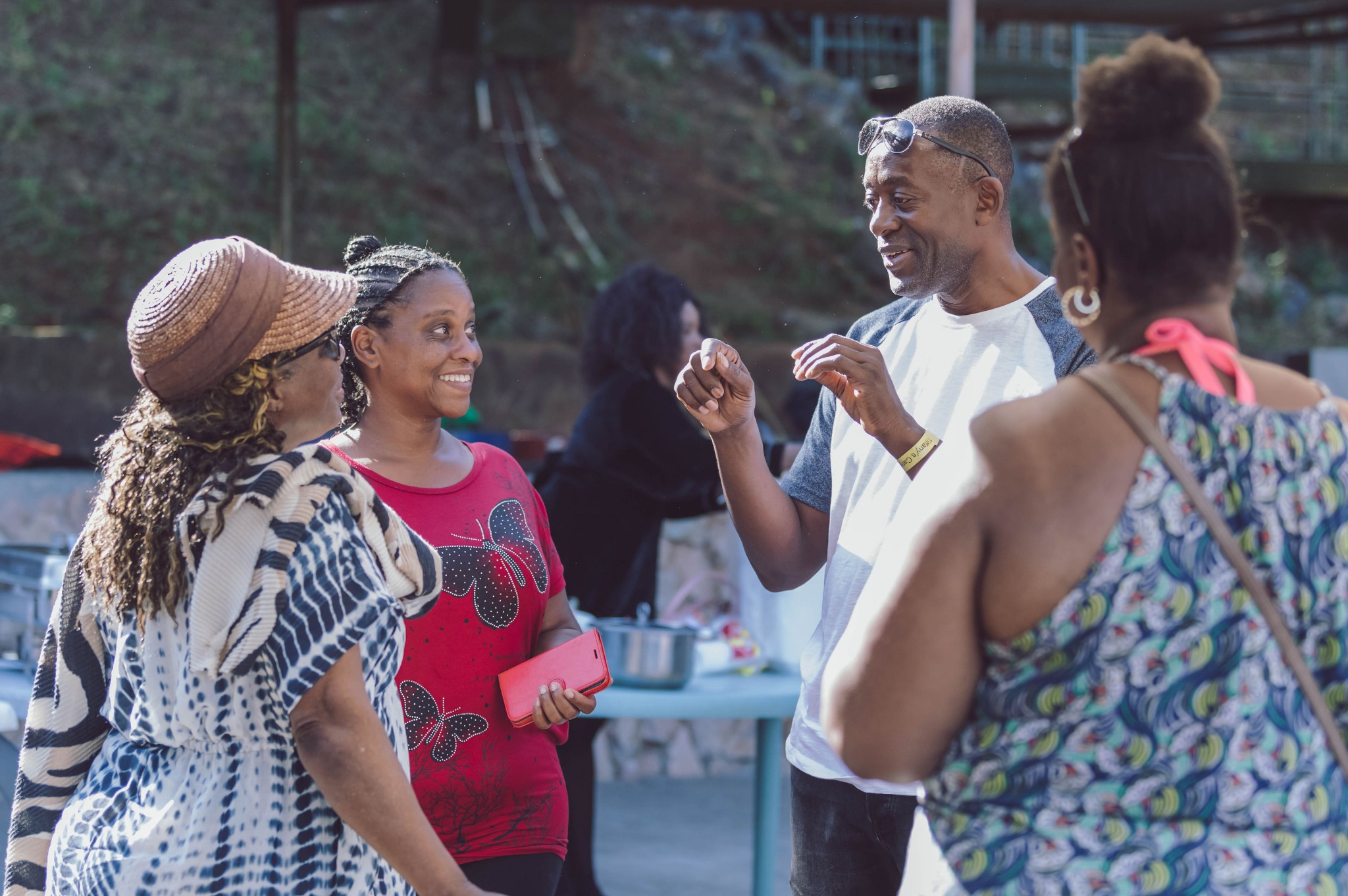 People talking outdoors during a community connection moment